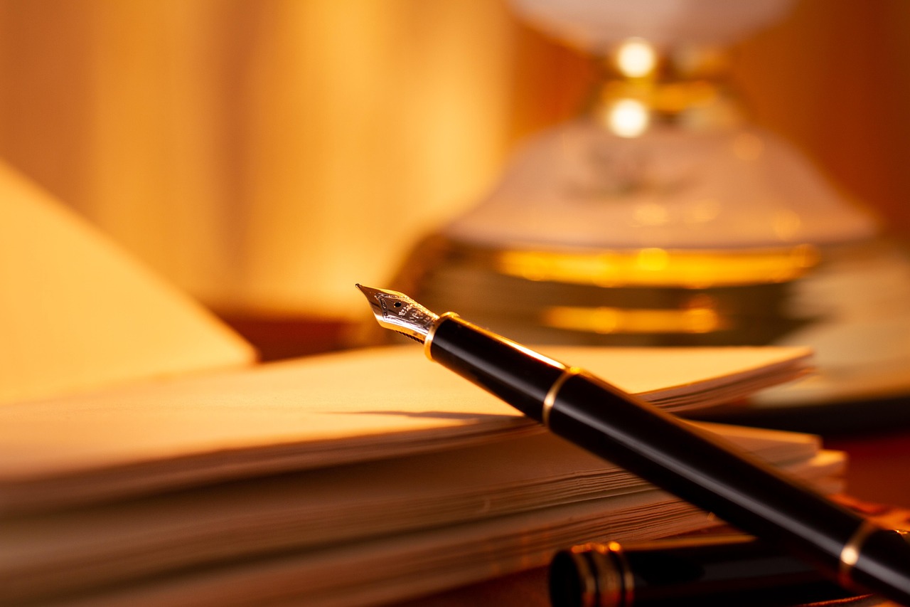 Fountain pen across an open notebook
